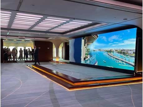 Luxury product launch event with LED presentation screen and stage setup
